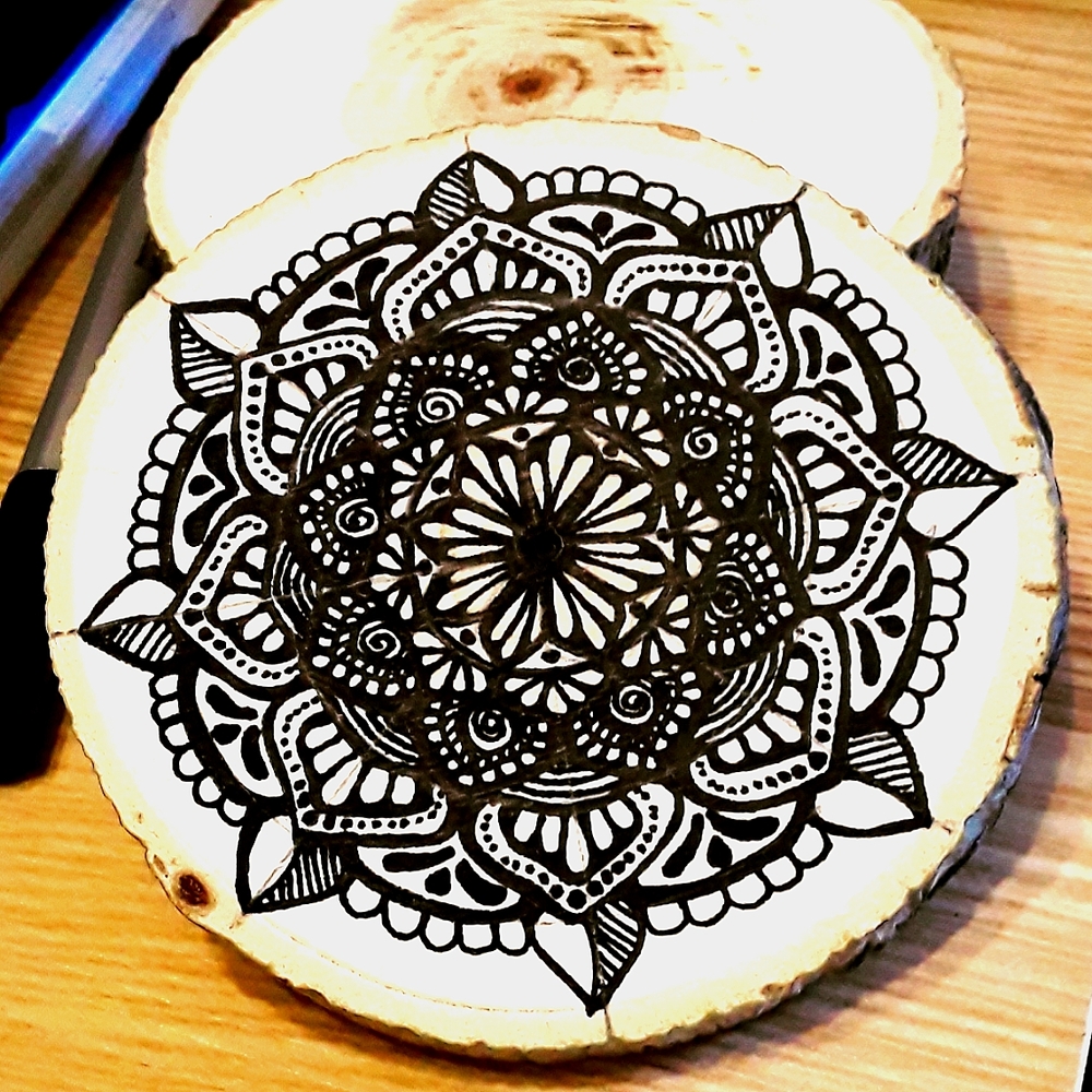Handmade mandala wood coasters. Resin coated to waterproof the design.